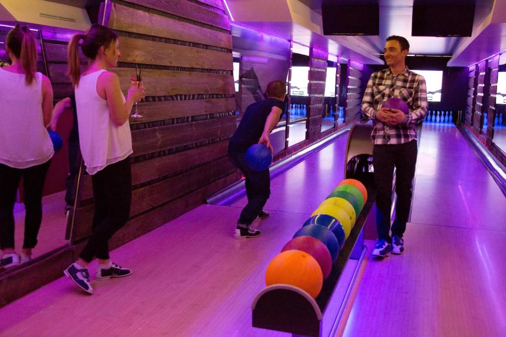 a group of people playing a game of bowling at Hôtel Les Barmes De l'Ours in Val-d'Isère