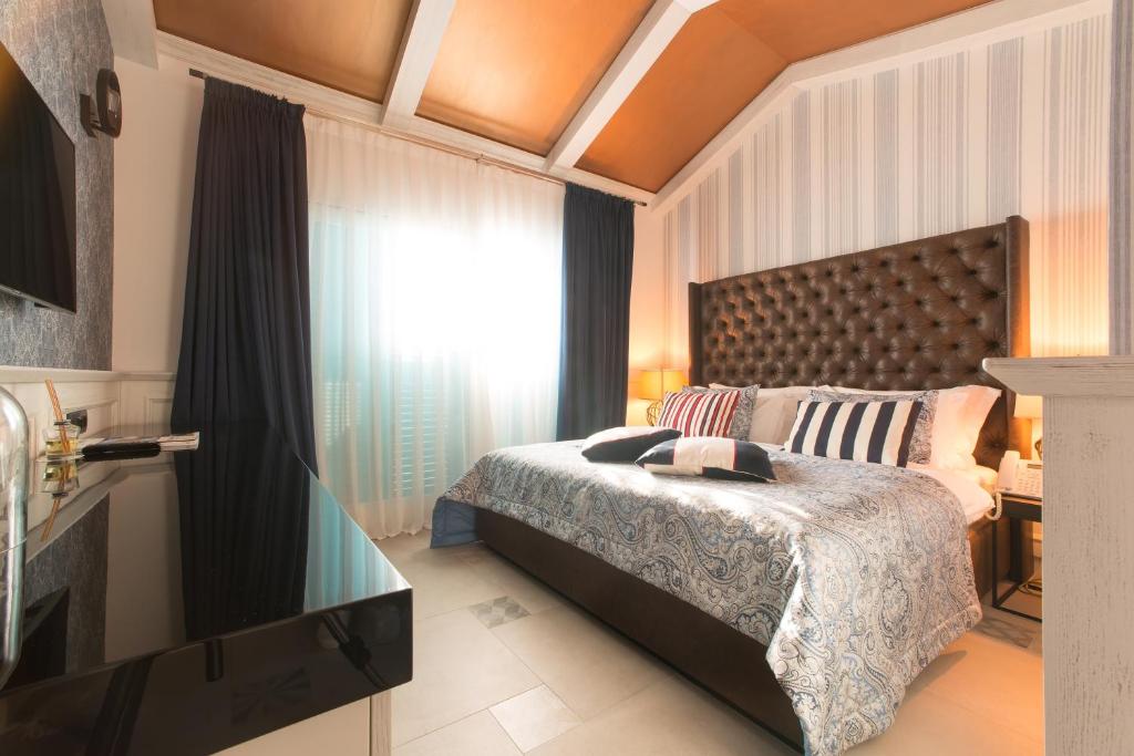 Postel nebo postele na pokoji v ubytování Hotel Forza Terra