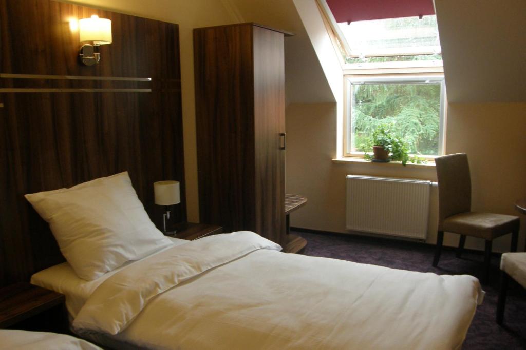 Posteľ alebo postele v izbe v ubytovaní Hotel Belfer