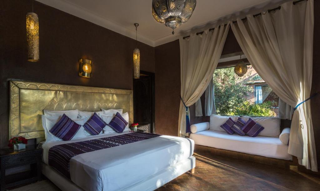 Postel nebo postele na pokoji v ubytování Riad Jawad & Spa