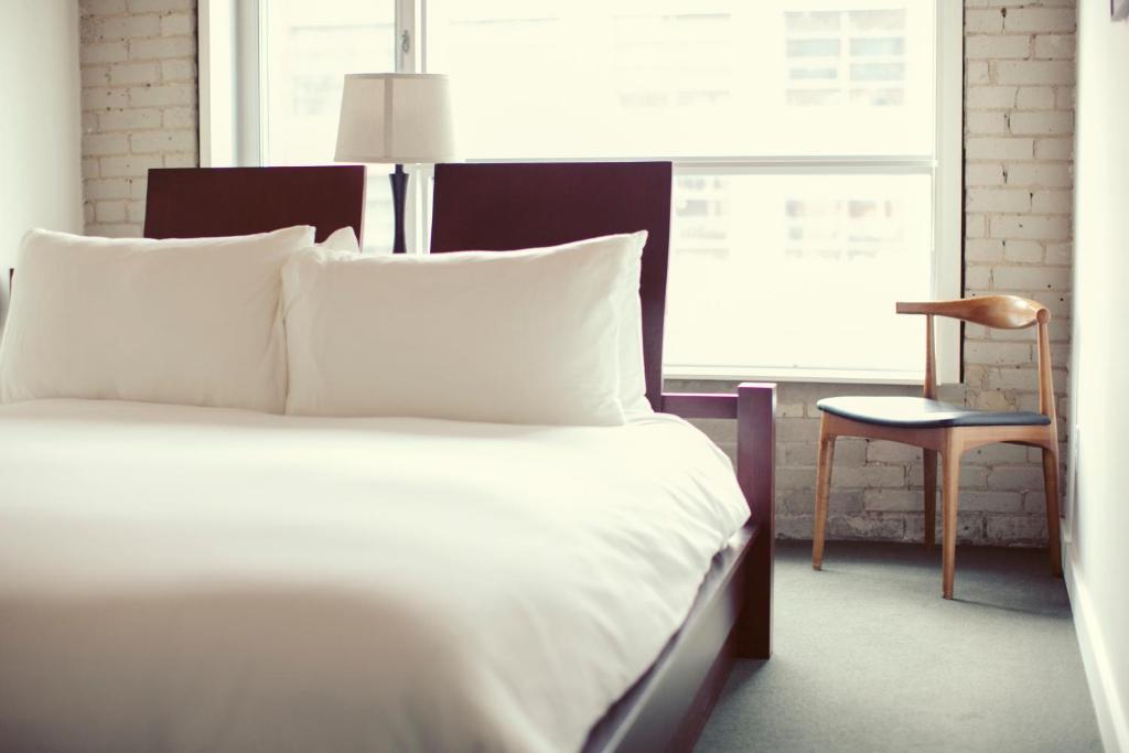 Postel nebo postele na pokoji v ubytování Hotel Ocho
