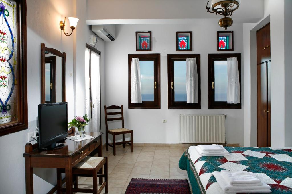 Postel nebo postele na pokoji v ubytování Archontiko Elda