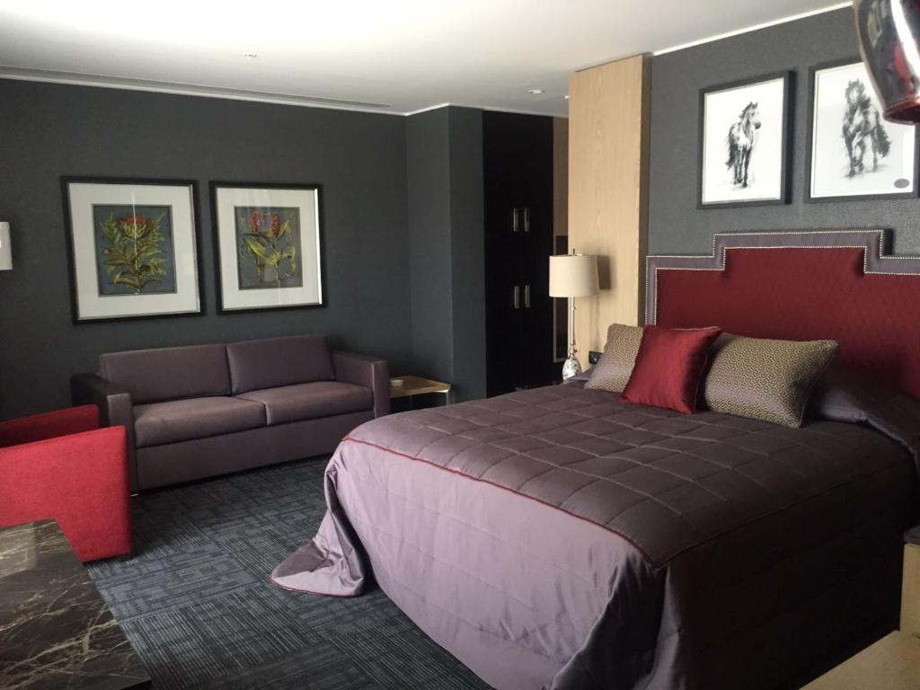 Postel nebo postele na pokoji v ubytování Mia City Hotel