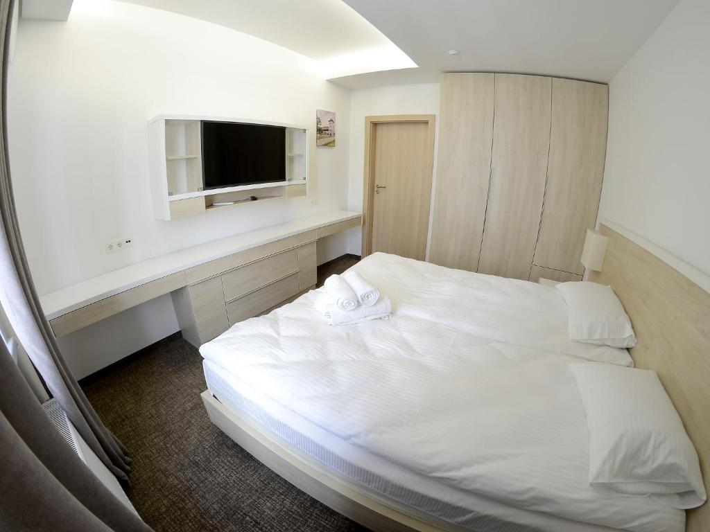 Tempat tidur dalam kamar di Apartment OneClickRent 2 SmartHouse