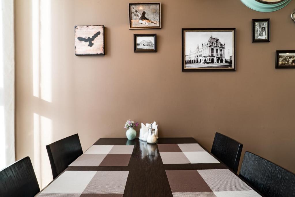 a dining room with a table and chairs at Business Hotel Diplomat in Nizhny Novgorod