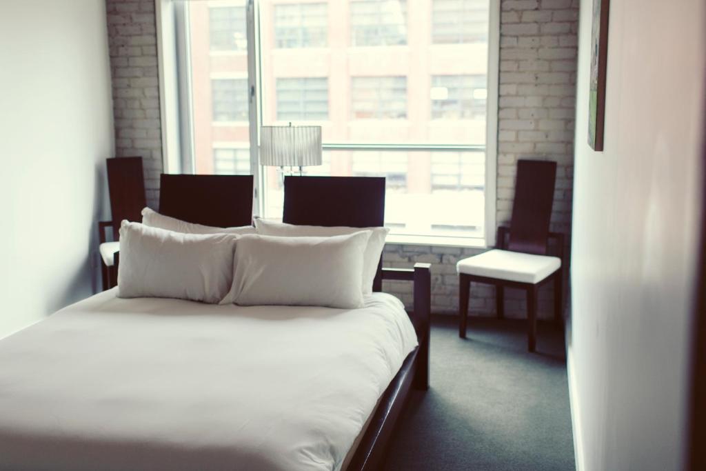 Postel nebo postele na pokoji v ubytování Hotel Ocho