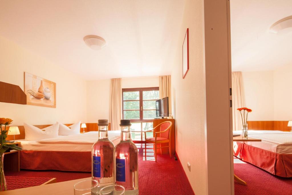 Postel nebo postele na pokoji v ubytování Kim Hotel Im Park