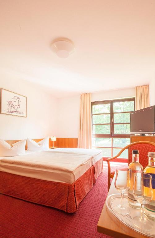 Postel nebo postele na pokoji v ubytování Kim Hotel Im Park