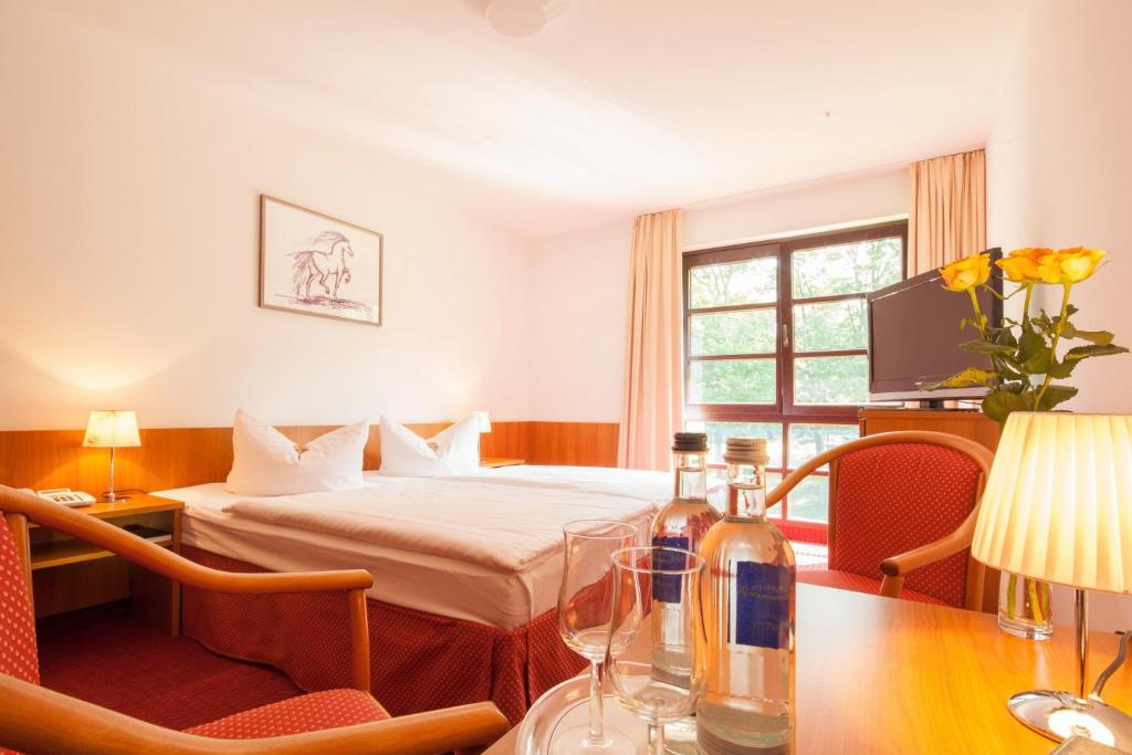 Postel nebo postele na pokoji v ubytování Kim Hotel Im Park