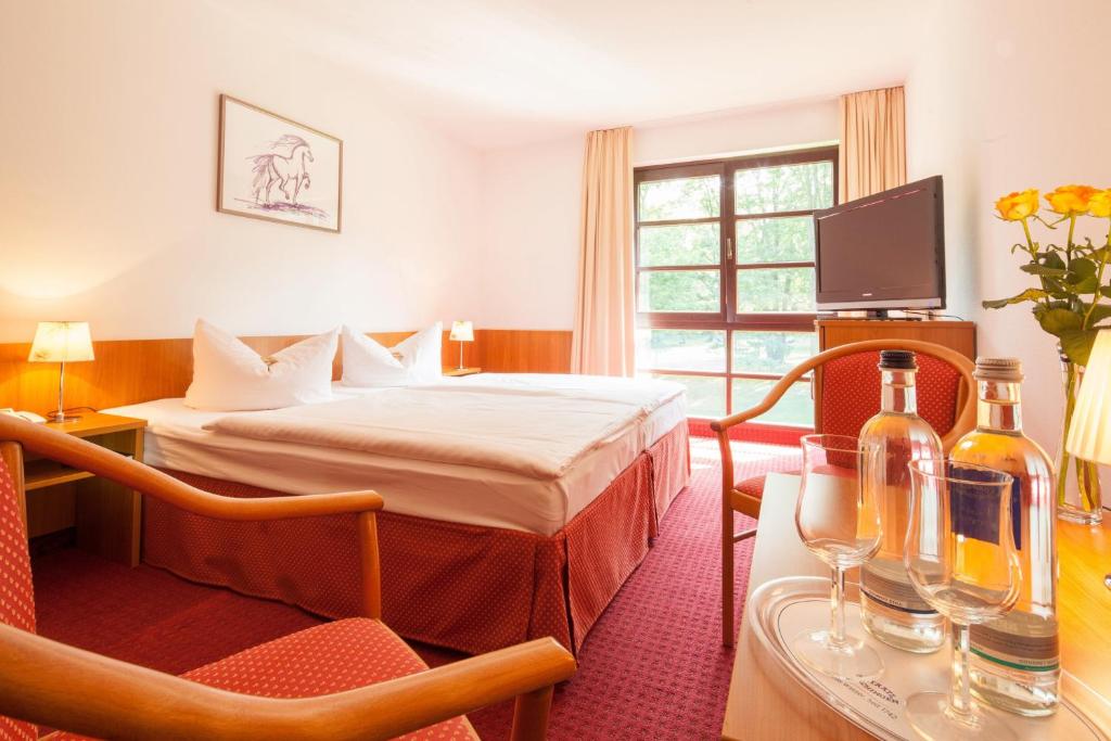 Postel nebo postele na pokoji v ubytování Kim Hotel Im Park