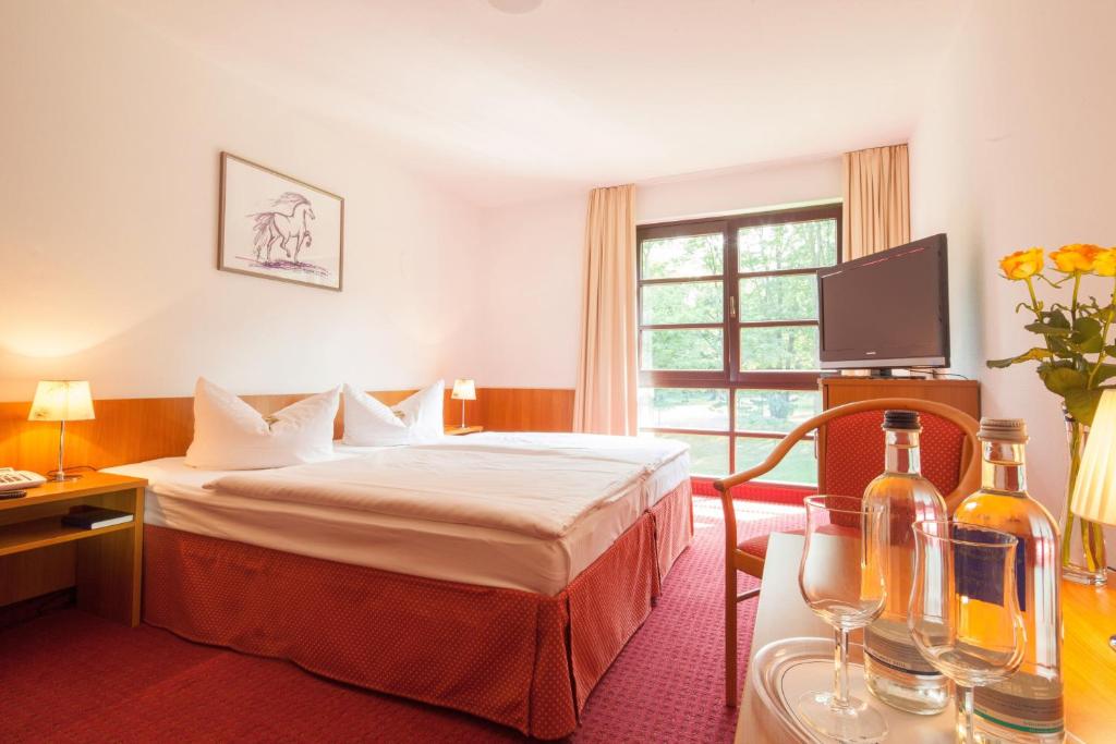 Postel nebo postele na pokoji v ubytování Kim Hotel Im Park