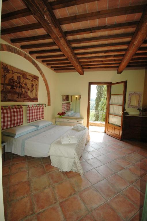Postel nebo postele na pokoji v ubytování Agriturismo Le Querce