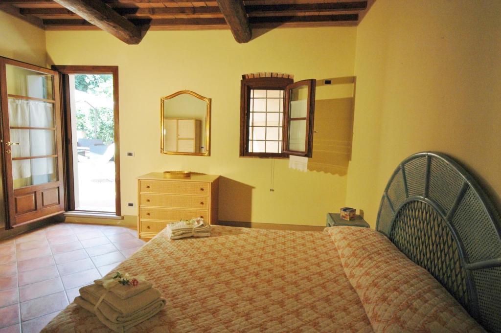 Postel nebo postele na pokoji v ubytování Agriturismo Le Querce