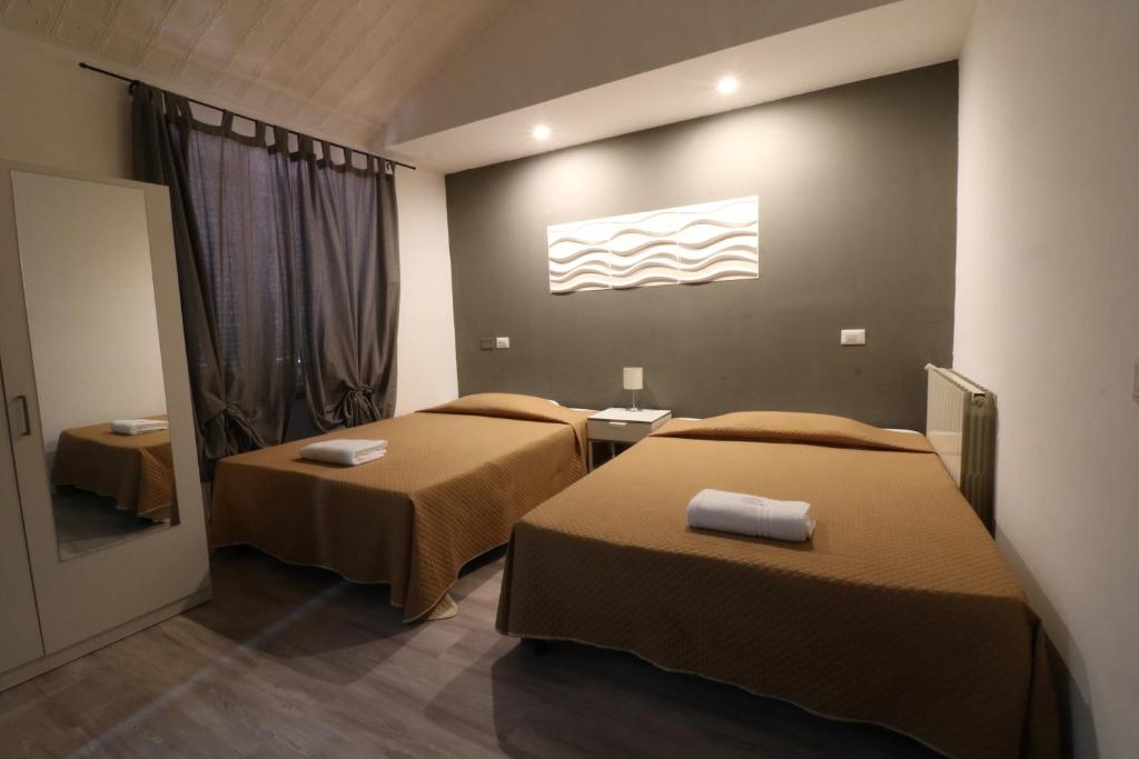 Letto o letti in una camera di Guest House Minas