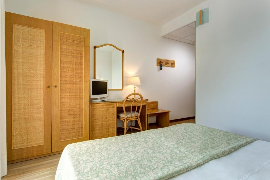 Ein Bett oder Betten in einem Zimmer der Unterkunft Hotel Croce Di Malta