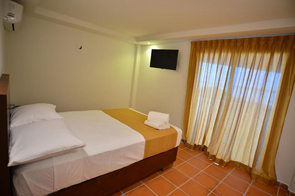 Postel nebo postele na pokoji v ubytování Hotel Rio Lagartos