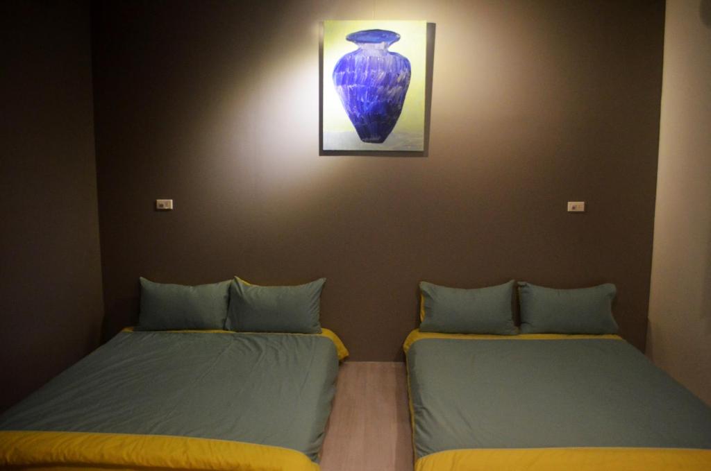 Postel nebo postele na pokoji v ubytování 菜爺爺親子蔬宿Vegepapa B&B