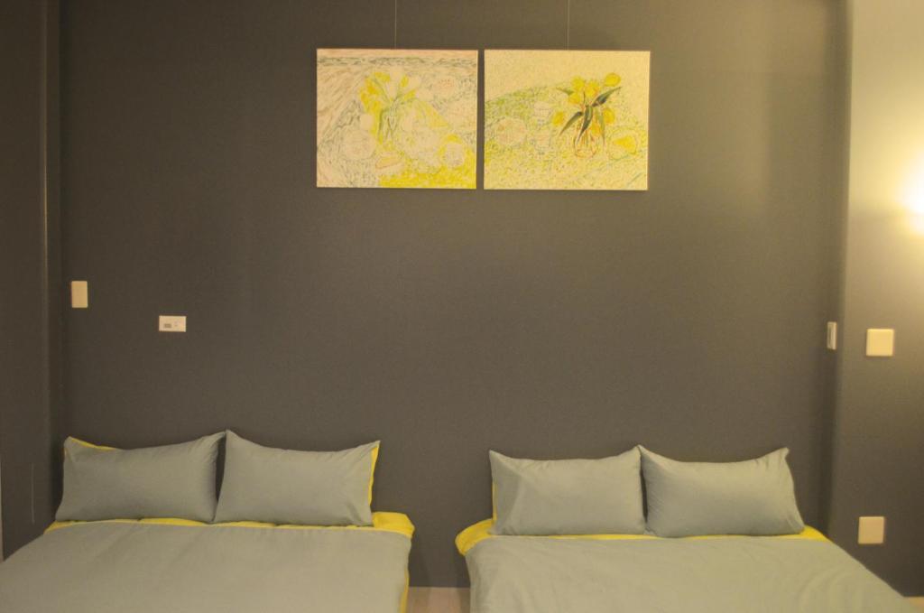 Postel nebo postele na pokoji v ubytování 菜爺爺親子蔬宿Vegepapa B&B