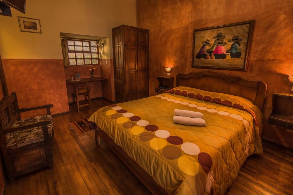 Postel nebo postele na pokoji v ubytování Hotel San Francisco De Quito