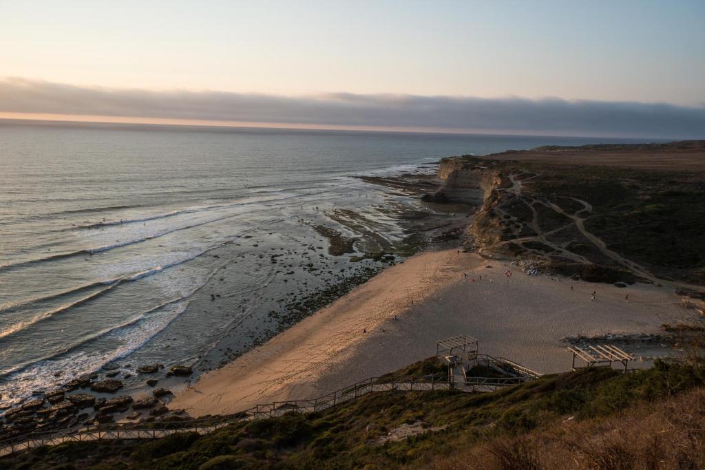 an aerial view of a beach next to the ocean at Beach House Ericeira in Ericeira