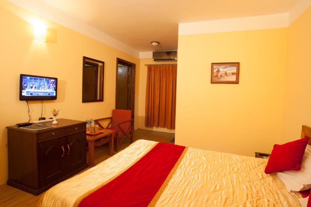 Postel nebo postele na pokoji v ubytování Royal Astoria Hotel