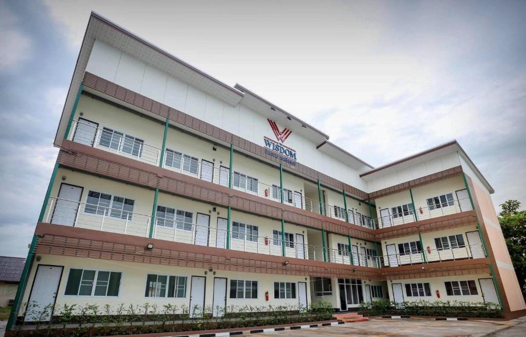 a large building with a lot of windows at The Wisdom Residence in Bung Kan