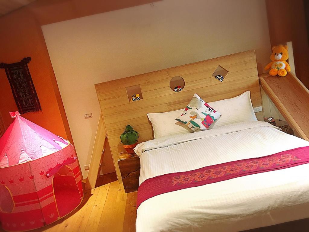 Postel nebo postele na pokoji v ubytování Shang Shui Yun Ji B&B
