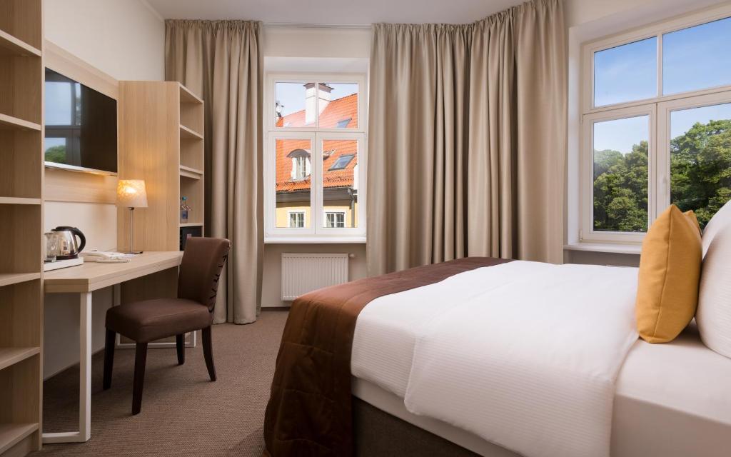Postel nebo postele na pokoji v ubytování Radisson Hotel Old Town Riga