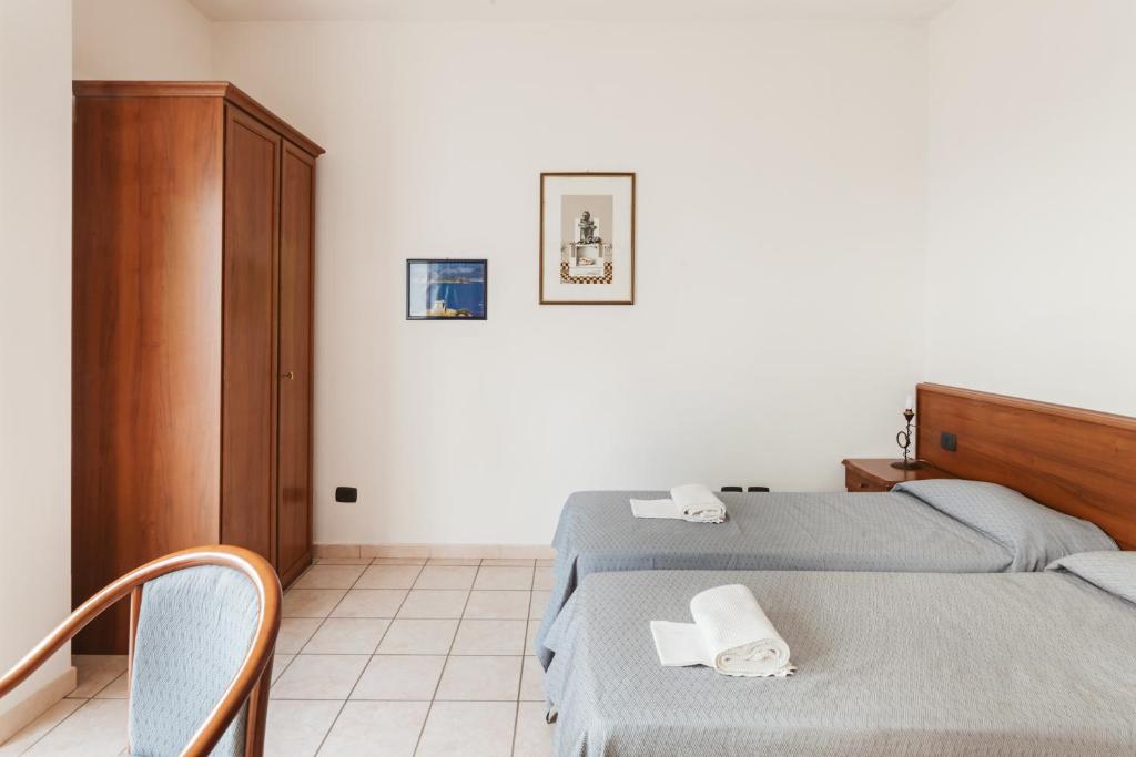Postel nebo postele na pokoji v ubytování Hotel Bellavista