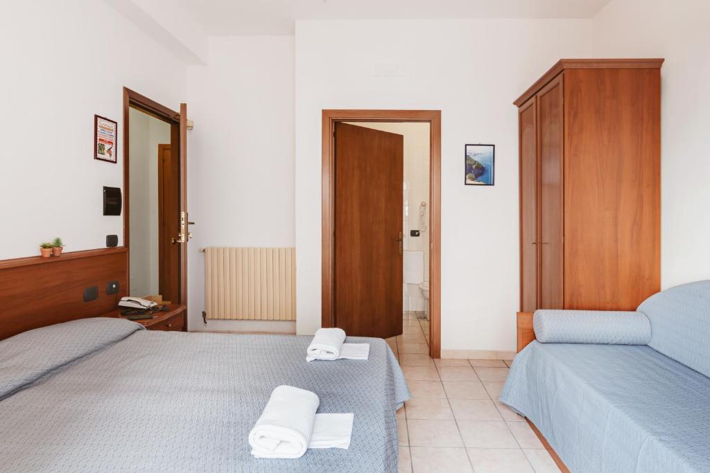 Postel nebo postele na pokoji v ubytování Hotel Bellavista