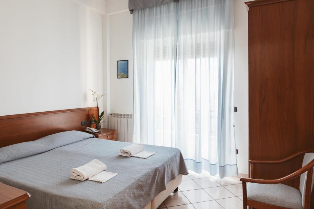 Postel nebo postele na pokoji v ubytování Hotel Bellavista