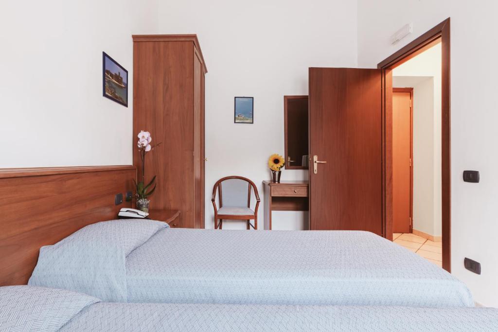 Postel nebo postele na pokoji v ubytování Hotel Bellavista