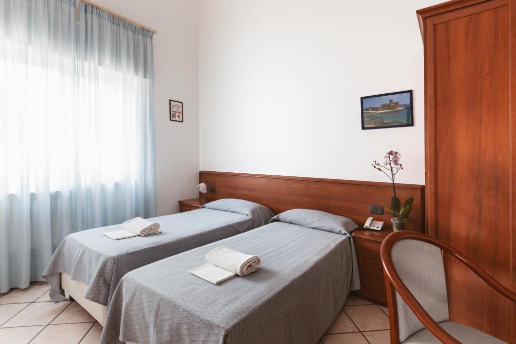 Postel nebo postele na pokoji v ubytování Hotel Bellavista