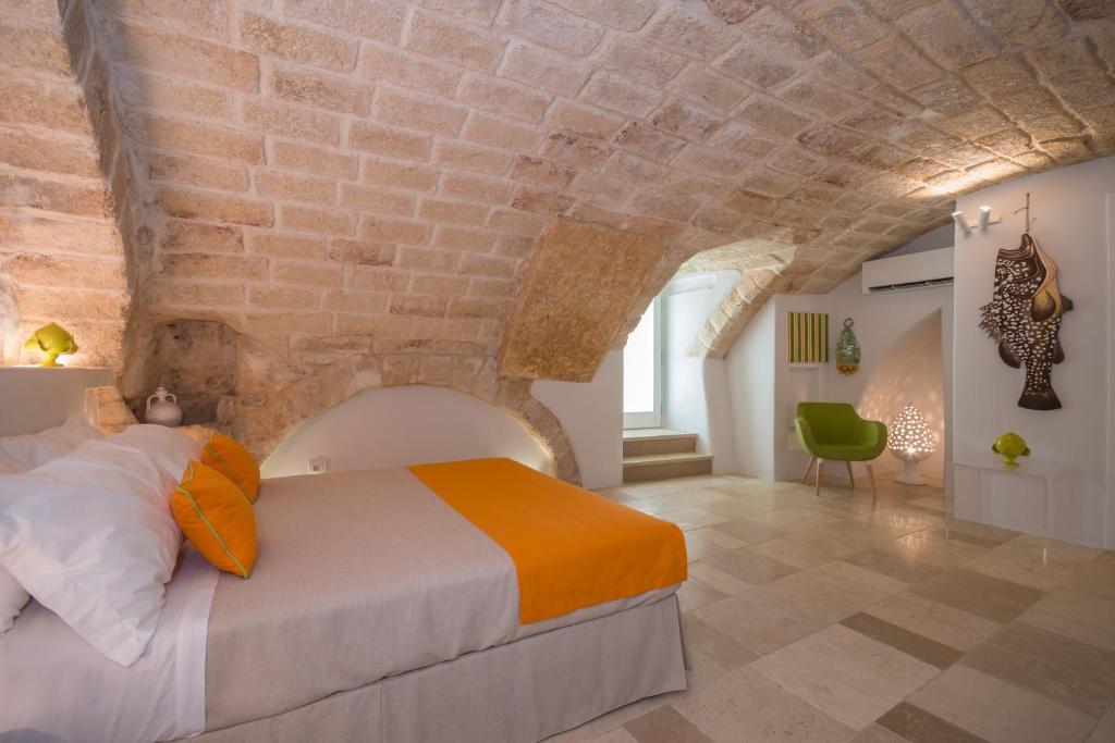 Postel nebo postele na pokoji v ubytování Palazzo Maringelli