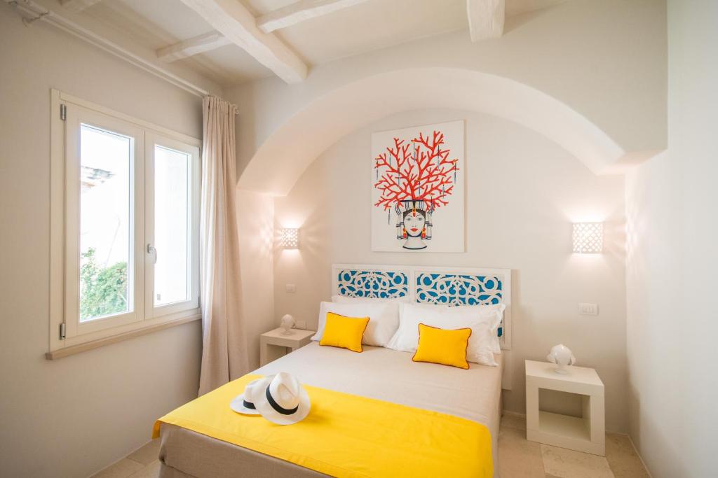 Postel nebo postele na pokoji v ubytování Palazzo Maringelli