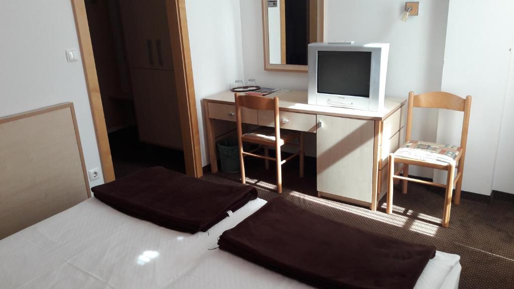 Postel nebo postele na pokoji v ubytování Rooms K