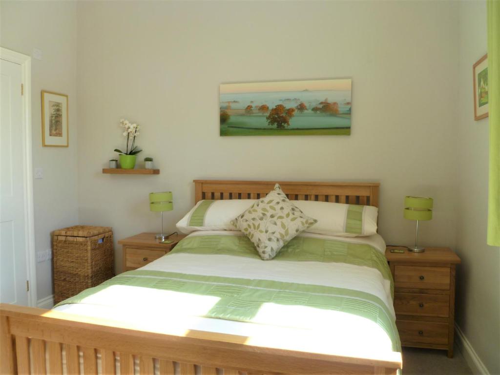 Postel nebo postele na pokoji v ubytování Chalice Lodge
