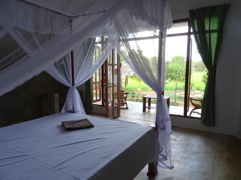 Postel nebo postele na pokoji v ubytování Nelu Villa Sigiriya