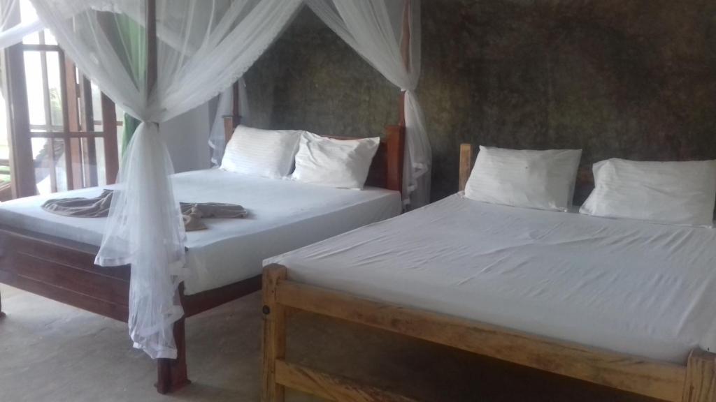 Postel nebo postele na pokoji v ubytování Nelu Villa Sigiriya