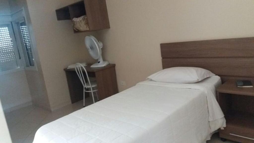 Postel nebo postele na pokoji v ubytování Imbau Palace Hotel