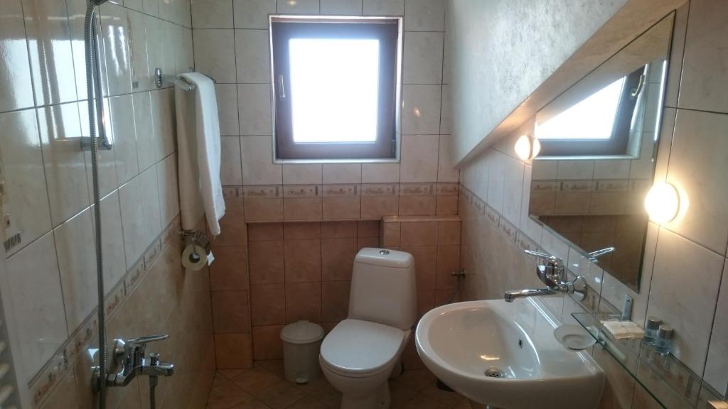 Koupelna v ubytování Classic Hotel