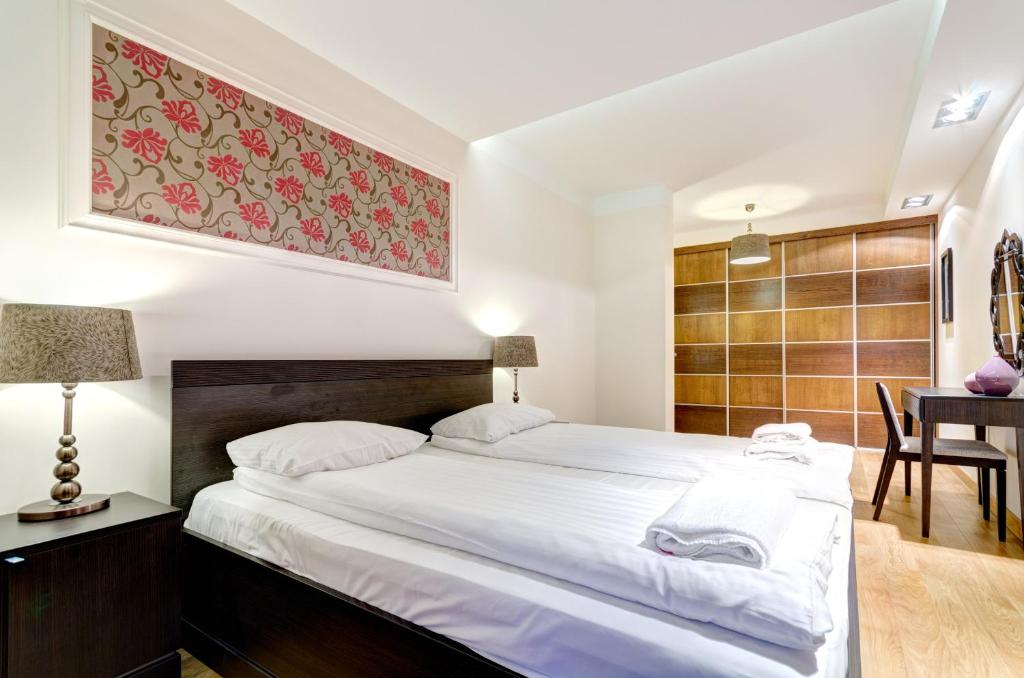 Posteľ alebo postele v izbe v ubytovaní Apartments Old Town Szafarnia & by Noclegi Renters
