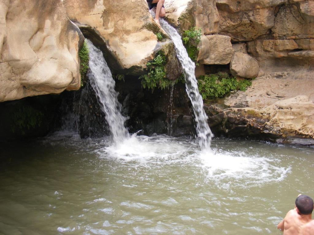 a waterfall in a pool of water at Nof Canaan in Kfar Adumim