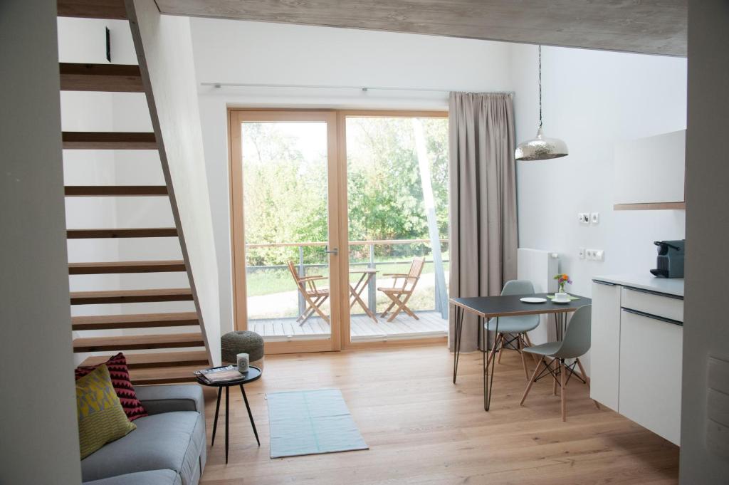 a living room with a couch and a table at Aiglberger Hofapartments in Steyr