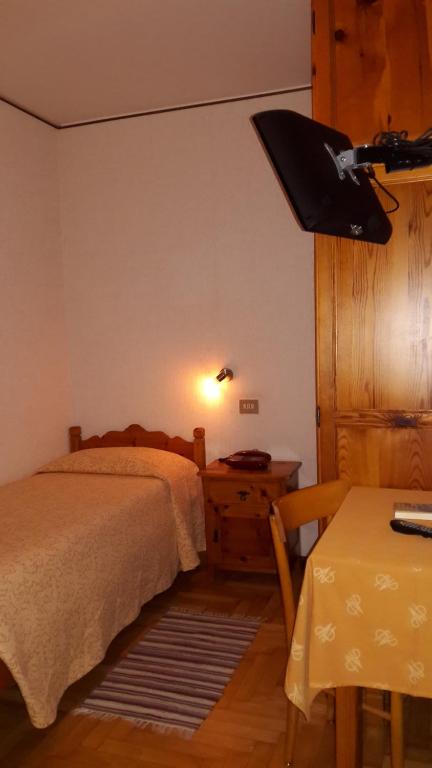 Postel nebo postele na pokoji v ubytování Hotel Vallecetta
