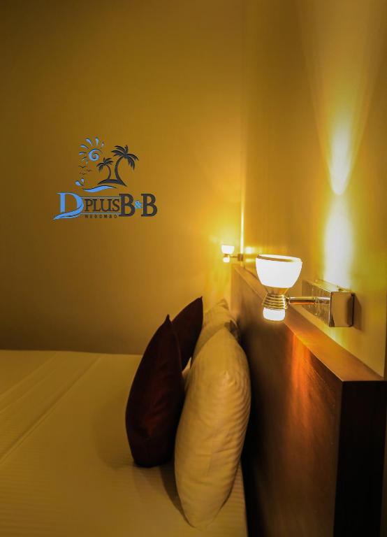 Postel nebo postele na pokoji v ubytování D Plus B&B Negombo