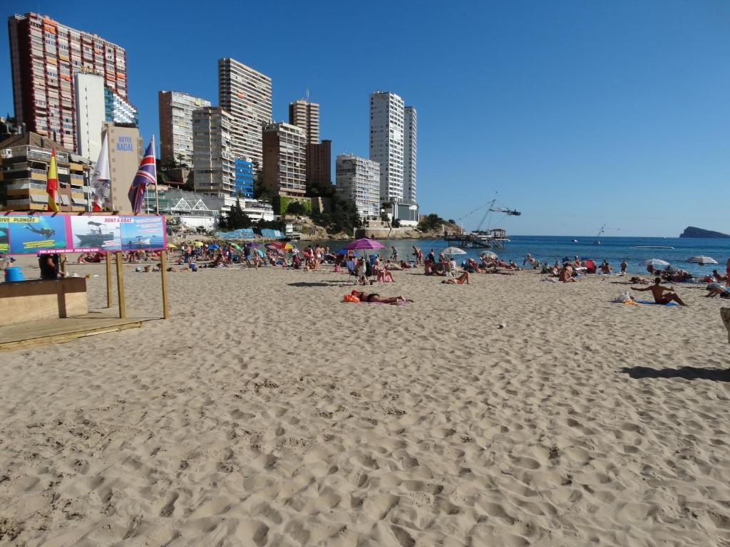 a group of people laying on a beach at Apartment 2 bedrooms, 250m Levante beach in Benidorm