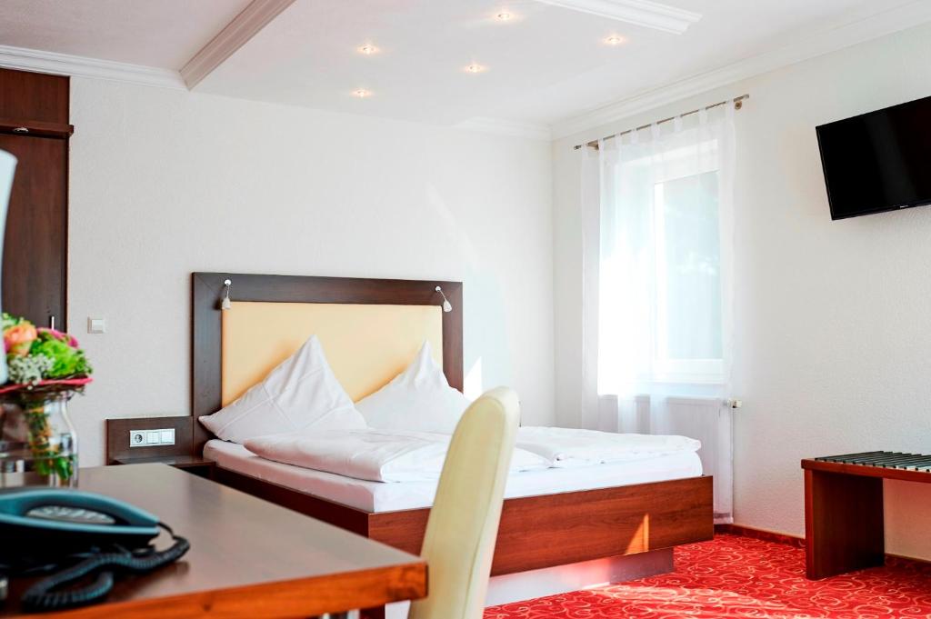 Gulta vai gultas numurā naktsmītnē ALTE LINDE Landhotel & Restaurant