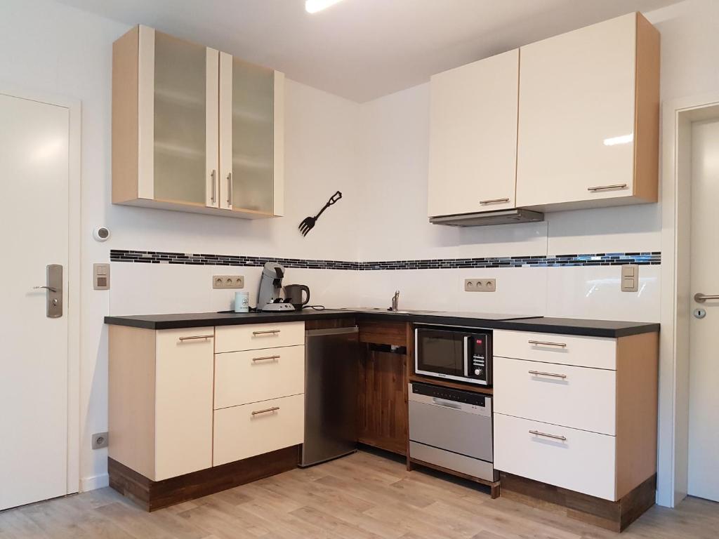 Kuchyň nebo kuchyňský kout v ubytování Aparthouse HAAS41 - Eupen