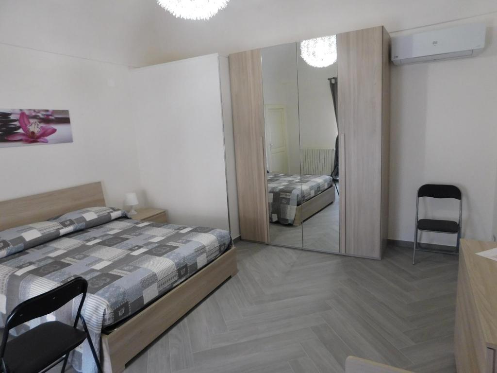 Postel nebo postele na pokoji v ubytování Palazzo dei Vespri